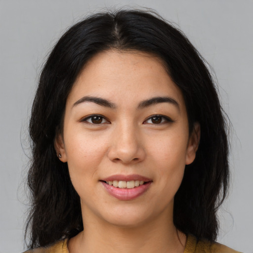 Joyful latino young-adult female with medium  brown hair and brown eyes