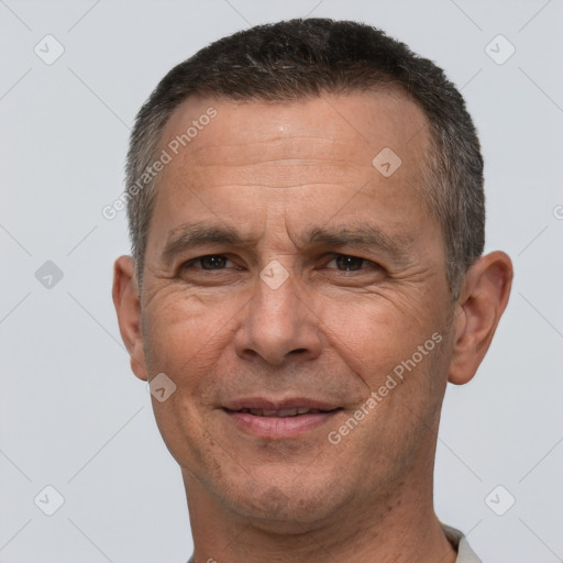 Joyful white middle-aged male with short  brown hair and brown eyes