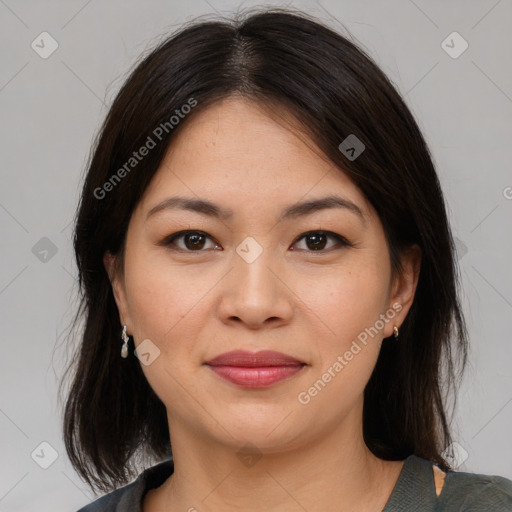 Joyful asian young-adult female with medium  brown hair and brown eyes