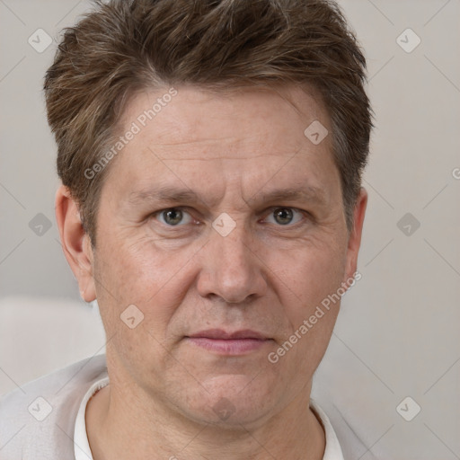 Joyful white adult male with short  brown hair and grey eyes