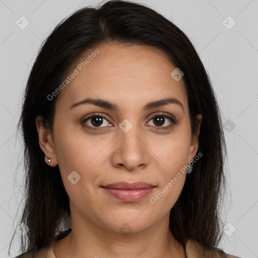 Joyful latino young-adult female with long  brown hair and brown eyes