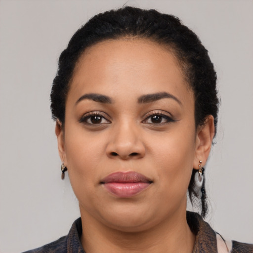 Joyful latino young-adult female with medium  black hair and brown eyes
