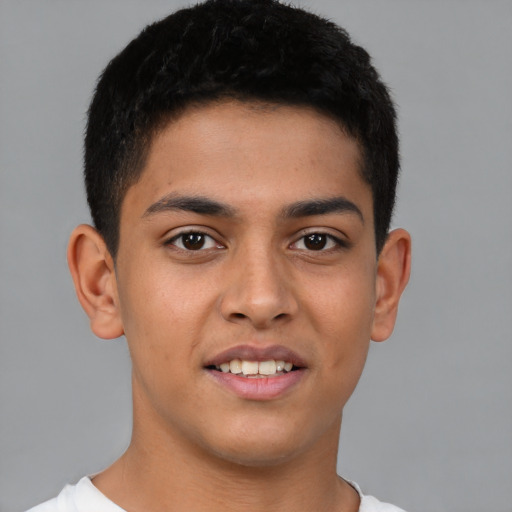 Joyful latino young-adult male with short  brown hair and brown eyes