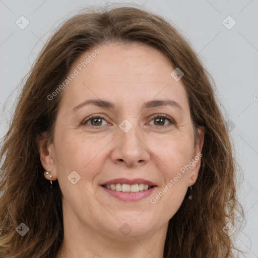 Joyful white adult female with long  brown hair and brown eyes