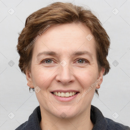 Joyful white adult female with short  brown hair and grey eyes