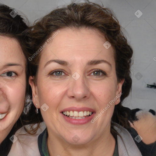 Joyful white adult female with medium  brown hair and blue eyes