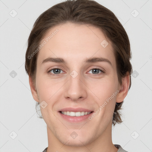 Joyful white young-adult female with short  brown hair and grey eyes