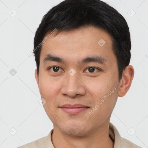 Joyful white young-adult male with short  black hair and brown eyes