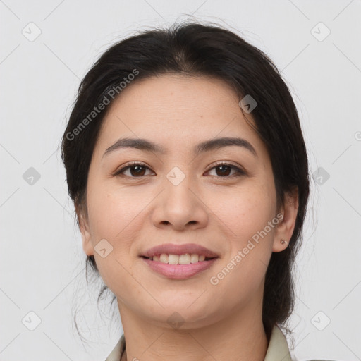 Joyful latino young-adult female with medium  brown hair and brown eyes