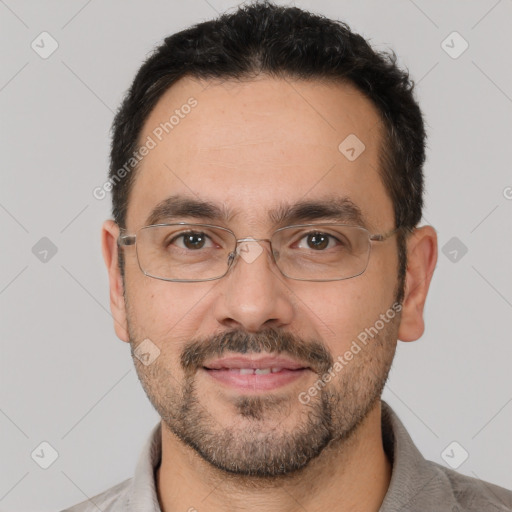 Joyful white adult male with short  black hair and brown eyes