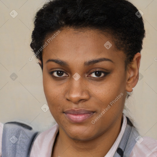 Joyful black young-adult female with short  brown hair and brown eyes