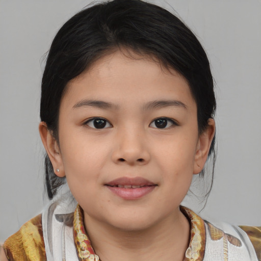 Joyful asian child female with medium  brown hair and brown eyes