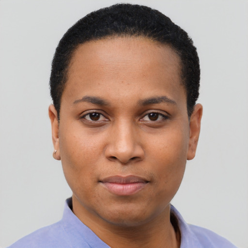 Joyful latino young-adult female with short  black hair and brown eyes