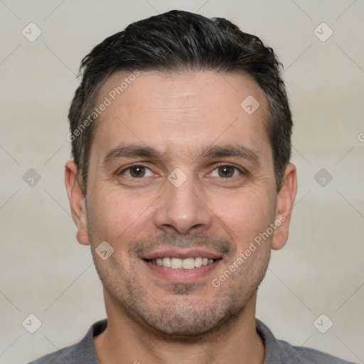 Joyful white young-adult male with short  black hair and brown eyes