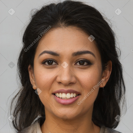 Joyful latino young-adult female with medium  brown hair and brown eyes