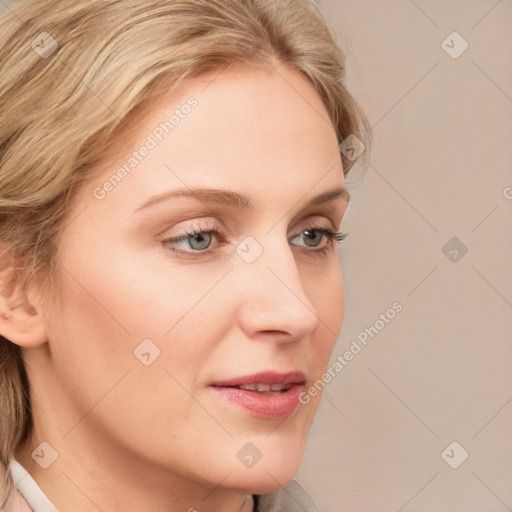 Joyful white young-adult female with medium  brown hair and blue eyes