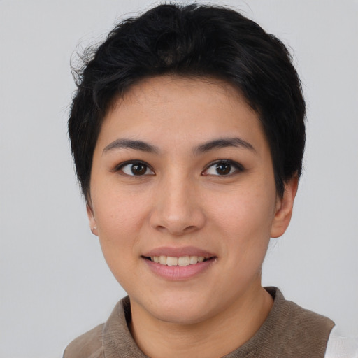 Joyful asian young-adult female with short  black hair and brown eyes