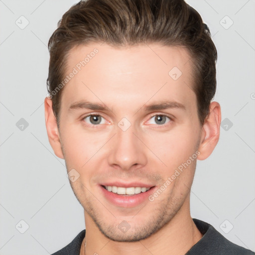 Joyful white young-adult male with short  brown hair and grey eyes