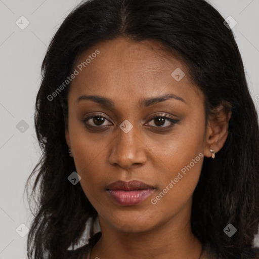 Joyful black young-adult female with long  brown hair and brown eyes