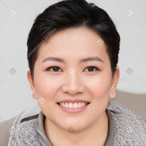 Joyful asian young-adult female with short  brown hair and brown eyes