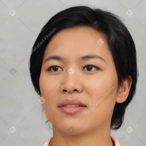 Joyful asian young-adult female with medium  black hair and brown eyes