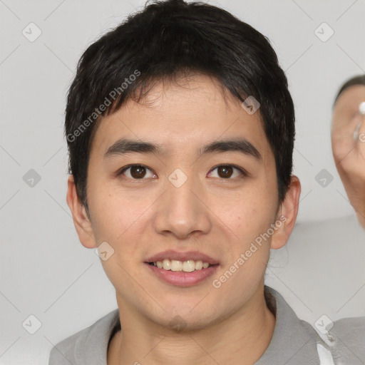 Joyful white young-adult male with short  black hair and brown eyes