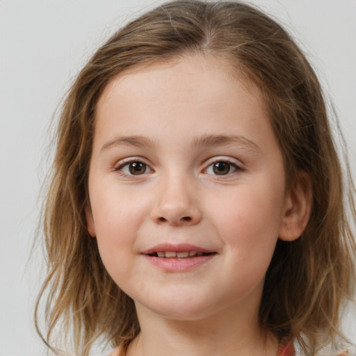 Joyful white child female with medium  brown hair and brown eyes