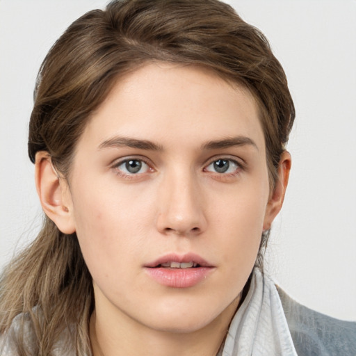 Neutral white young-adult female with long  brown hair and brown eyes