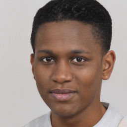 Joyful black young-adult male with short  brown hair and brown eyes