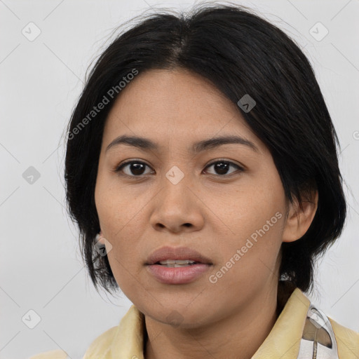 Joyful asian young-adult female with medium  black hair and brown eyes