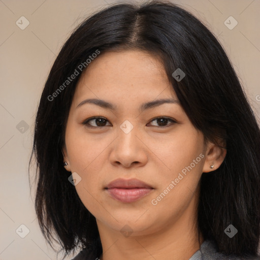 Joyful asian young-adult female with long  black hair and brown eyes