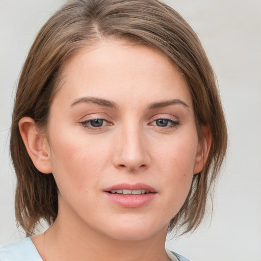 Joyful white young-adult female with medium  brown hair and blue eyes