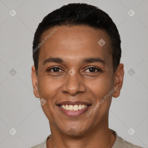 Joyful latino young-adult male with short  black hair and brown eyes