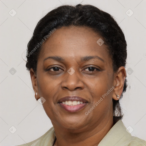 Joyful black adult female with short  brown hair and brown eyes