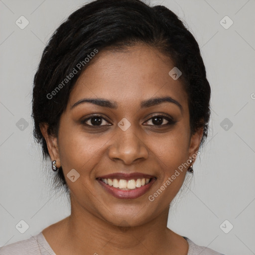 Joyful black young-adult female with medium  brown hair and brown eyes