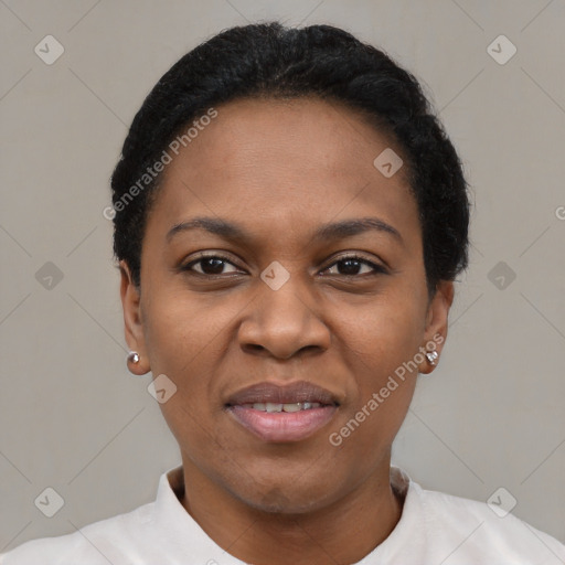 Joyful black adult female with short  black hair and brown eyes