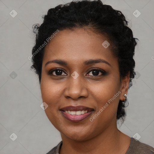 Joyful black young-adult female with short  brown hair and brown eyes