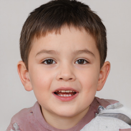 Joyful white child male with short  brown hair and brown eyes