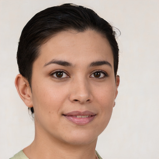 Joyful white young-adult female with short  brown hair and brown eyes