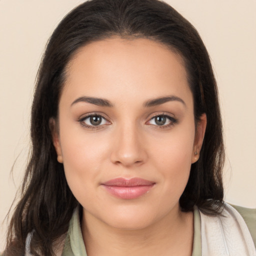 Joyful white young-adult female with long  brown hair and brown eyes