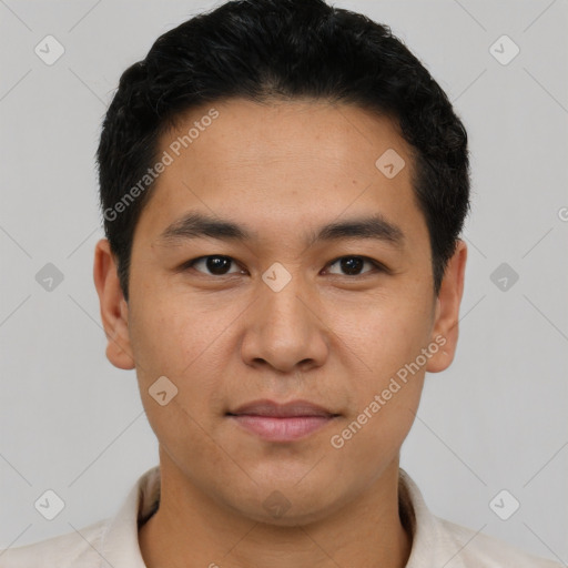 Joyful latino young-adult male with short  black hair and brown eyes