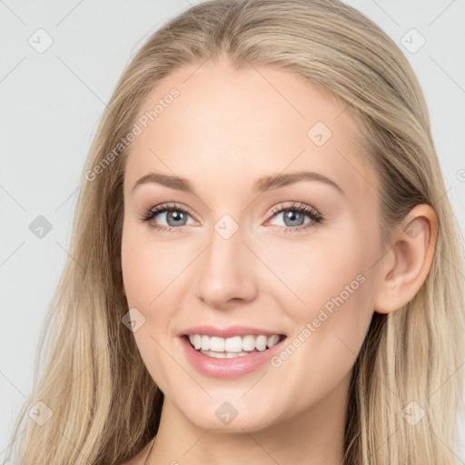 Joyful white young-adult female with long  brown hair and blue eyes