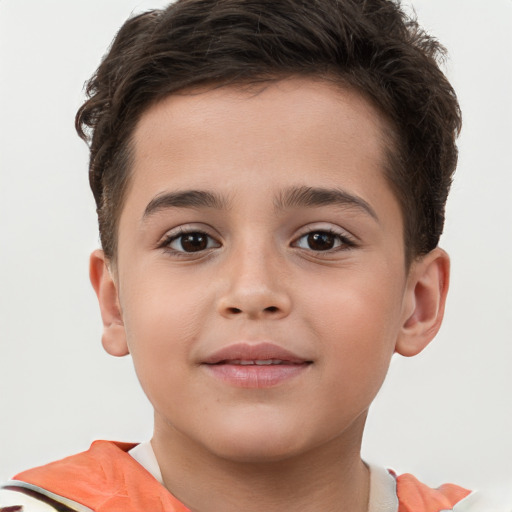 Joyful white child male with short  brown hair and brown eyes