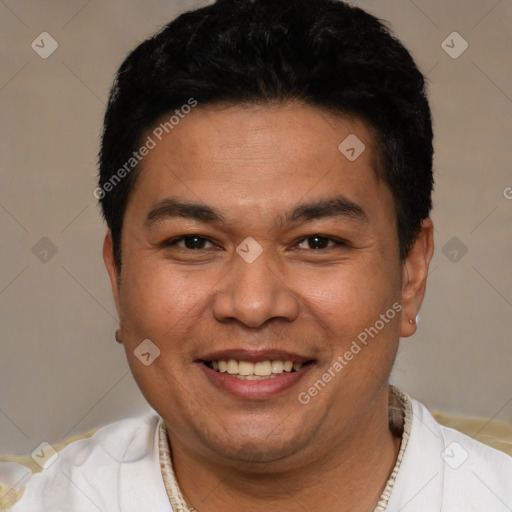 Joyful white adult male with short  black hair and brown eyes