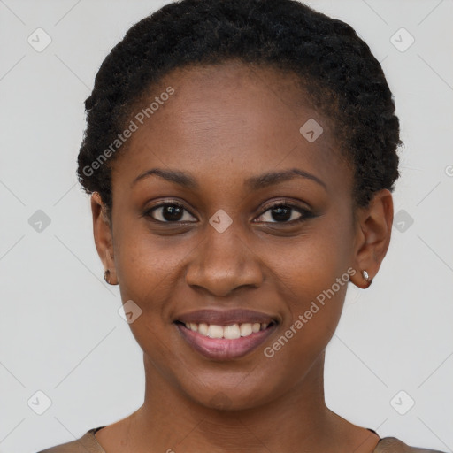 Joyful black young-adult female with short  brown hair and brown eyes