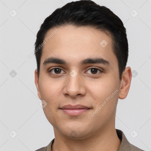 Joyful white young-adult male with short  black hair and brown eyes