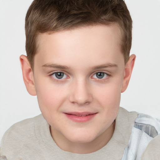 Joyful white child male with short  brown hair and brown eyes