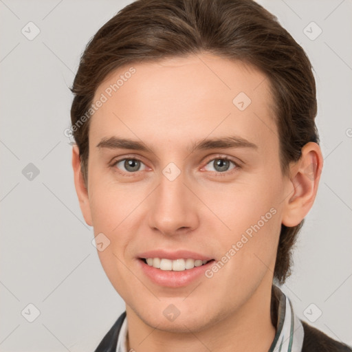 Joyful white young-adult female with short  brown hair and grey eyes