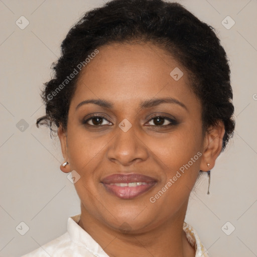 Joyful black adult female with short  brown hair and brown eyes