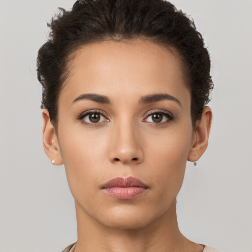 Neutral white young-adult female with short  brown hair and brown eyes